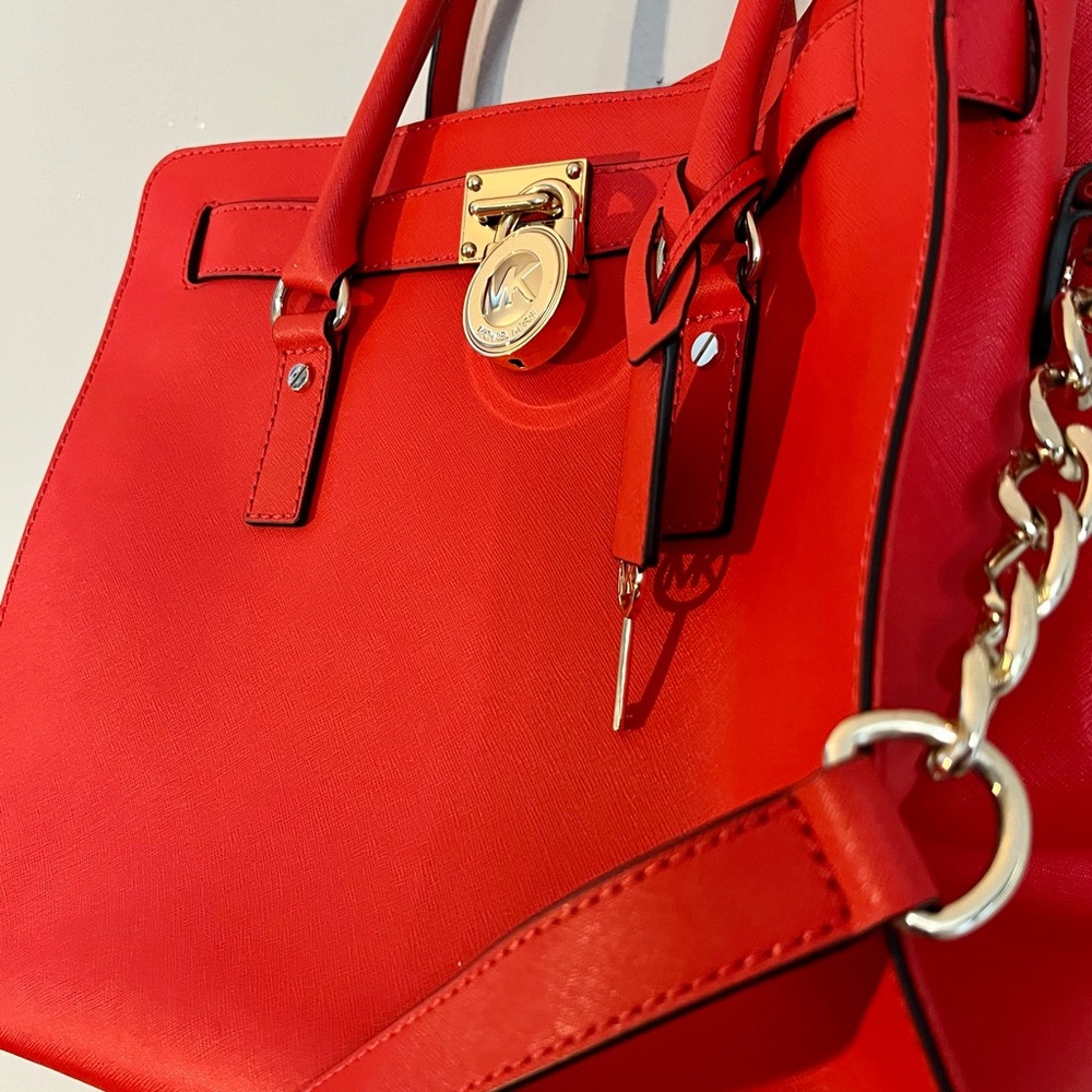 Fiery red Michael Kors power purse with gold hardware